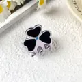 Small acetate clover hair claw in lilac and black with sparkling rhinestone detail - Purple