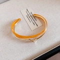 Double-layered minimalist open bangle with orange resin and gold plated metal finish - Gold Orange