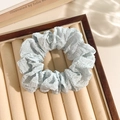 Light blue floral lace scrunchie on a premium velvet tray with elegant wood frame - Blue Seersucker