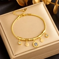 Elegant 18K gold plated titanium steel bracelet with roman numeral charms and cubic zirconia - Bracelet