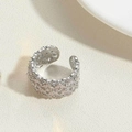 Macro detail of adjustable silver ring with hollow flower design and zircon inlay - White Gold Hollow Full Zircon