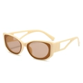 Oval cat-eye sunglasses with cream frame and brown lenses shown in a 45-degree angle - Rice White Frame / Tea Lens