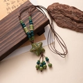 Bohemian ceramic starfish necklace with green beads and brown woven rope decoration - Green