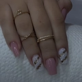 Macro detail of gold crown and crisscross rings with pink marble gold foil press-on nails - Minimalist Red Gray Marble