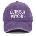 Detailed view of white CUTE BUT PSYCHO embroidery on a vintage purple washed cotton cap - One Size / Purple