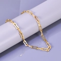 Minimalist 18K gold stainless steel chain bracelet displayed on a purple cylindrical stand - Necklace / 18K Gold