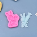 Pink silicone Easter bunny mold with a light blue rabbit figurine on blue background - Standing Little Rabbit Style (2)