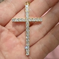 Sparkling gold zircon cross pendant shown on hand to demonstrate actual size and shine - Classic Full Zirconia Cross / Gold