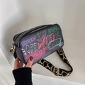Black graffiti crossbody bag with colorful street art and a wide jacquard strap - Black