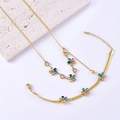 Conjunto de joyas doradas con collar de flores de circón y pulsera de borla de corazón - Juego