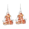 Detail showing handmade silver wire wrap earrings with natural red crystal stones - Red Agate