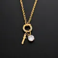 Stainless steel necklace with 14K gold finish featuring sword and crystal charms - Letter T