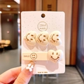 Beige fleece hair clip set with heart shapes and Smile embroidery on display card - J-35-Beige Smiley Face
