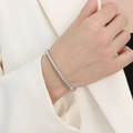 Polished stainless steel beaded bracelet worn with a minimalist cream blazer - Beaded Style / Silver