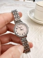 Close-up of elegant women's watch with pink diamond bezel dial and silver steel band - Silver / Pink Dial