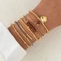 Five-piece stacked bracelet set with gold metal beads, butterfly charms, and brown stones - Crystal Seed Beads 7-Piece Set / Multicolor