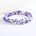 Detailed macro view of colorful purple, white and mint green beaded elastic waist chain - Purple White Mint Green