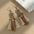 Detail of bohemian sunburst earrings featuring layered silk tassels and wooden beads - Sunflower Brown and Beige Tassel Style(E6316)