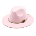 Close-up of pink wool fedora featuring a light brown braided band and metal beads - Pink