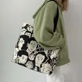 Borsa tote in tela con illustrazione di viso disegnata a mano e manici neri - Modello Ritratto Fronte-retro