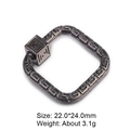 Macro shot of 22mm square copper pendant with Greek key pattern and grey zircon inlay - Square / Gunmetal
