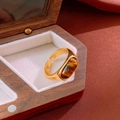 Macro shot of gold-plated tiger eye stone ring set against elegant red silk background - Gold Oval Tiger Eye Stone Open Style (5#)
