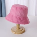 Pink plush faux rabbit fur bucket hat on wooden stand for women's winter fashion - 56-58cm / Pink