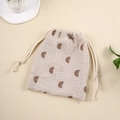 Detail of cotton muslin drawstring bag with brown rainbow print for baby items - Coffee Rainbow