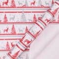 Christmas wrapping paper with red reindeer and silver trees on a white roll - Little Fawn Reindeer
