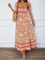 Dettaglio del vestito lungo estivo arancione a fiori con rifiniture a onde rosse eleganti - S / Fondo Arancione Stampa Floreale