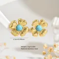 Golden stainless steel flower stud earrings featuring turquoise blue stone center - Stainless Steel Turquoise Flower Studs