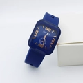 Detail view of square blue quartz watch with silicone strap and gold numerals showing weekday dial - Blue Number Style