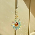 Rainbow crystal flower suncatcher with amber center and iridescent petals on silver chain - AB Iridescent Flower