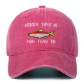Detailed close-up of fish embroidery and bold text on a washed rose red baseball cap - Rose Red
