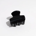 Top view of a small glossy black resin hair claw clip with smooth polished finish - Black