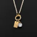 Collana in acciaio inossidabile placcato oro 14K con ciondolo CZ lucido e lettera N - Lettera N