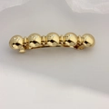 Elegant gold hair clip featuring five polished metal spheres on a spring barette - Gold Five Rounds Barrette