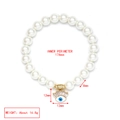Detail view of evil eye pearl bracelet with measurements of 174mm length and 8mm beads - Small Evil Eye (LE19GD07)