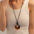 Detail of a minimalist long necklace with a round tortoiseshell acrylic pendant - Brown Leopard Circle Style