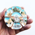 Handheld round resin 3D souvenir fridge magnet featuring Roma landmarks in blue and white - Rome 7 Views Vatican
