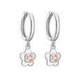 Detail view of silver flower earrings featuring square pink zircon and micro-pave setting - Silver Pink Zirconia Flower