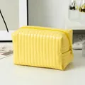 Yellow quilted floral cosmetic bag with vertical stitching and secure zipper closure - Candy Leather Yellow
