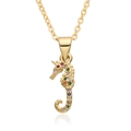 Macro detail of a gold seahorse pendant with colorful zircon stones on a white background - Seahorse Shape (B409)