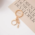 Detail of a shiny gold alloy keychain set with dual lobster clasps and linking chain - Gold 4-Link Chain + 303 Lobster Clasp