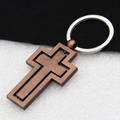 Macro detail of rotating cross keychain in bronze metal with dual-layer structure - Bronze