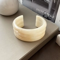 Close-up of cream resin cuff with triple-layer wave design and marble texture detail - 3-Layer Marble Pattern / Beige