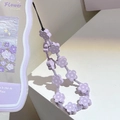 Macro detail of lavender flower beaded phone strap with durable black hanging cord - Lavender Flower Bead Strap