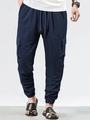 Close-up of deep blue waffle textured fabric on men's drawstring cargo pants - S / Bottoms / Navy Blue