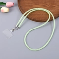 Macro detail of light green rhinestone mesh phone lanyard with silver metal clip and pad - Light Green