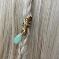 Detail of gold spiral hair jewelry with green teardrop crystal pendant on blonde braid - Green Pendant